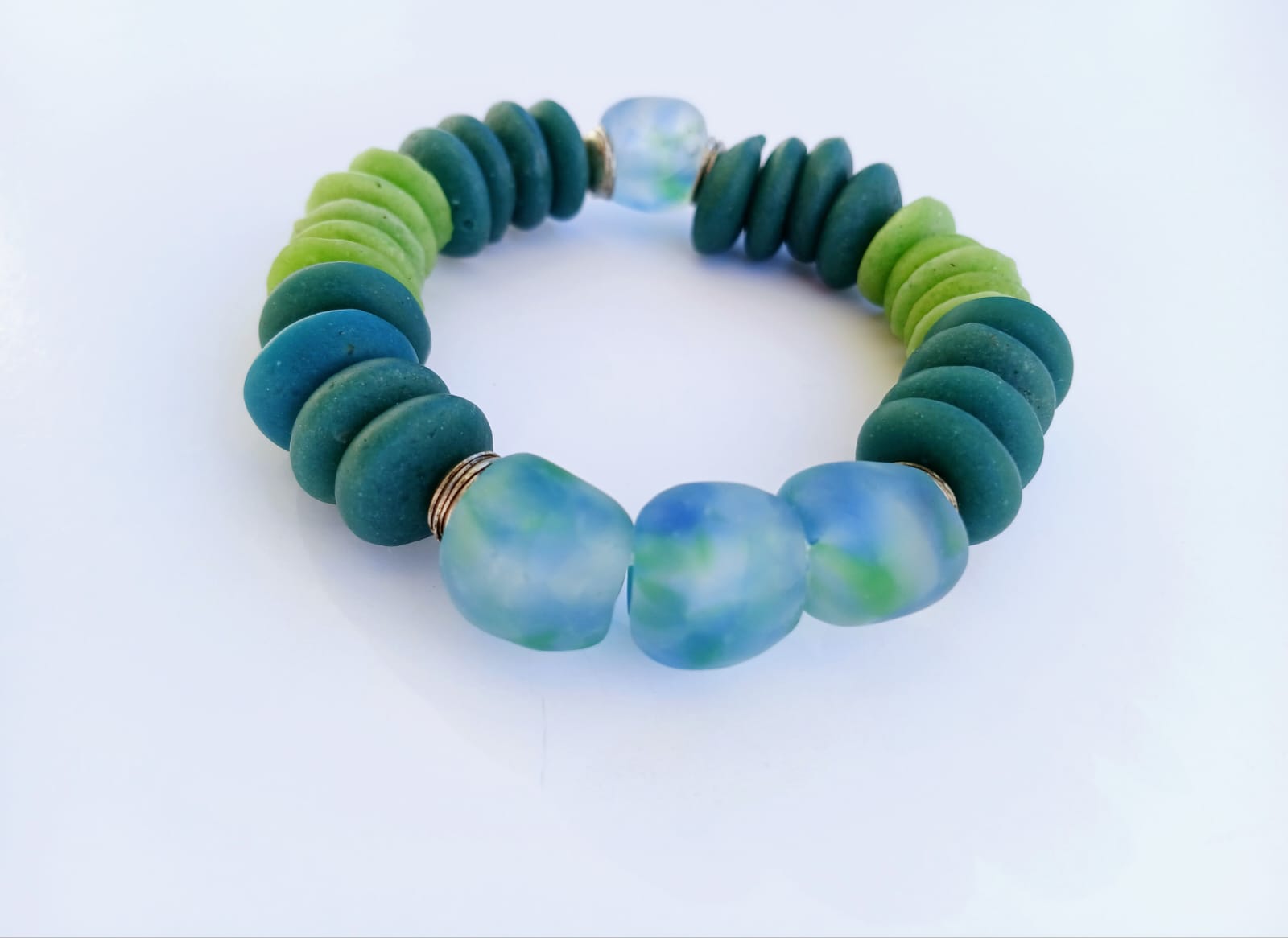 Multi Color Ashanti Blue Green Glass Beaded Bracelet featuring vibrant, handcrafted African trade beads in a bold, spiritual design. This colorful boho statement bracelet is inspired by traditional Ashanti craftsmanship, blending rich cultural heritage with modern style. Perfect handmade jewelry gift for women who love unique, meaningful accessories. Ideal for birthdays, holidays, or special occasions. A stunning piece full of color, energy, and artisan charm.