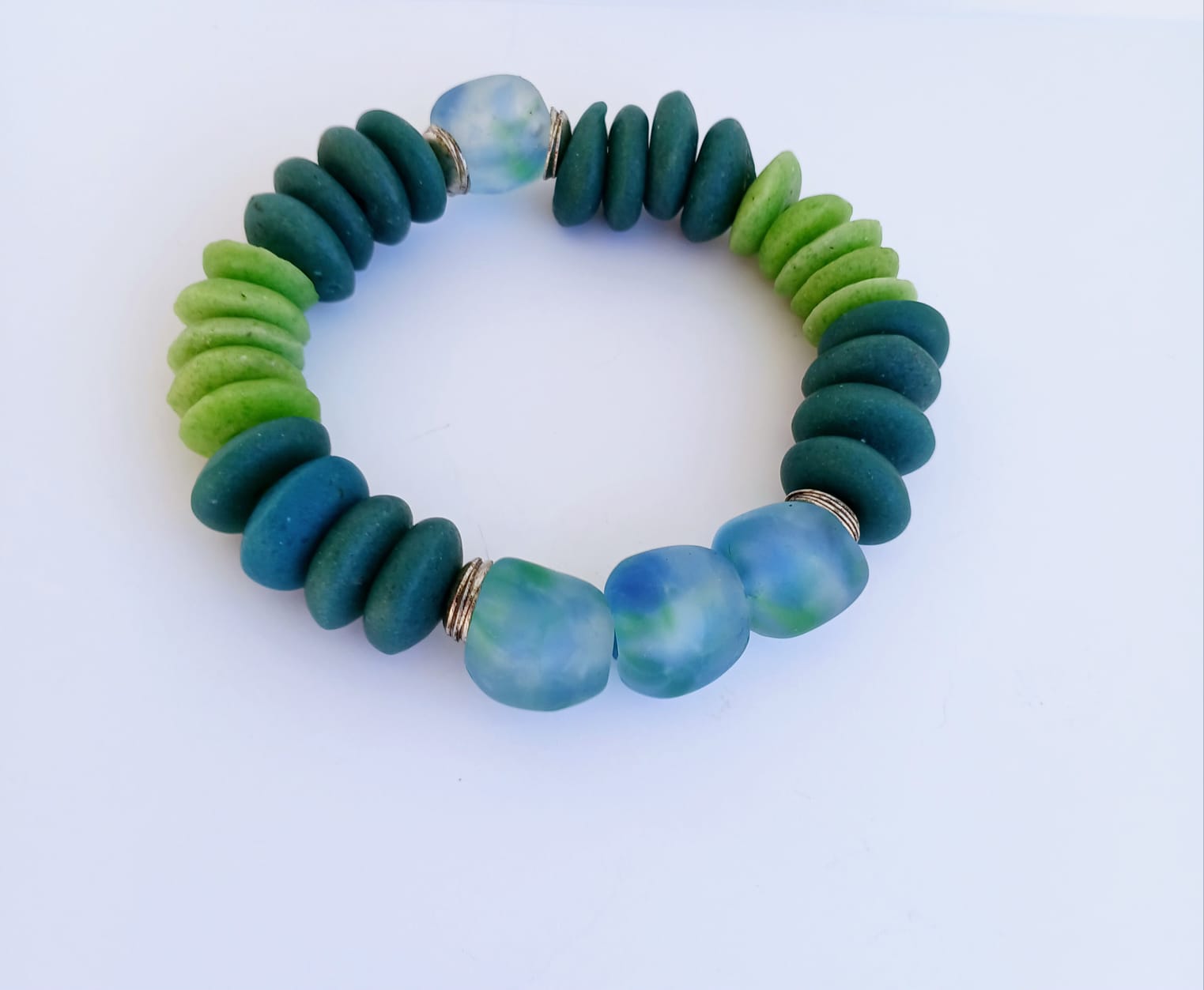 Multi Color Ashanti Blue Green Glass Beaded Bracelet featuring vibrant, handcrafted African trade beads in a bold, spiritual design. This colorful boho statement bracelet is inspired by traditional Ashanti craftsmanship, blending rich cultural heritage with modern style. Perfect handmade jewelry gift for women who love unique, meaningful accessories. Ideal for birthdays, holidays, or special occasions. A stunning piece full of color, energy, and artisan charm.