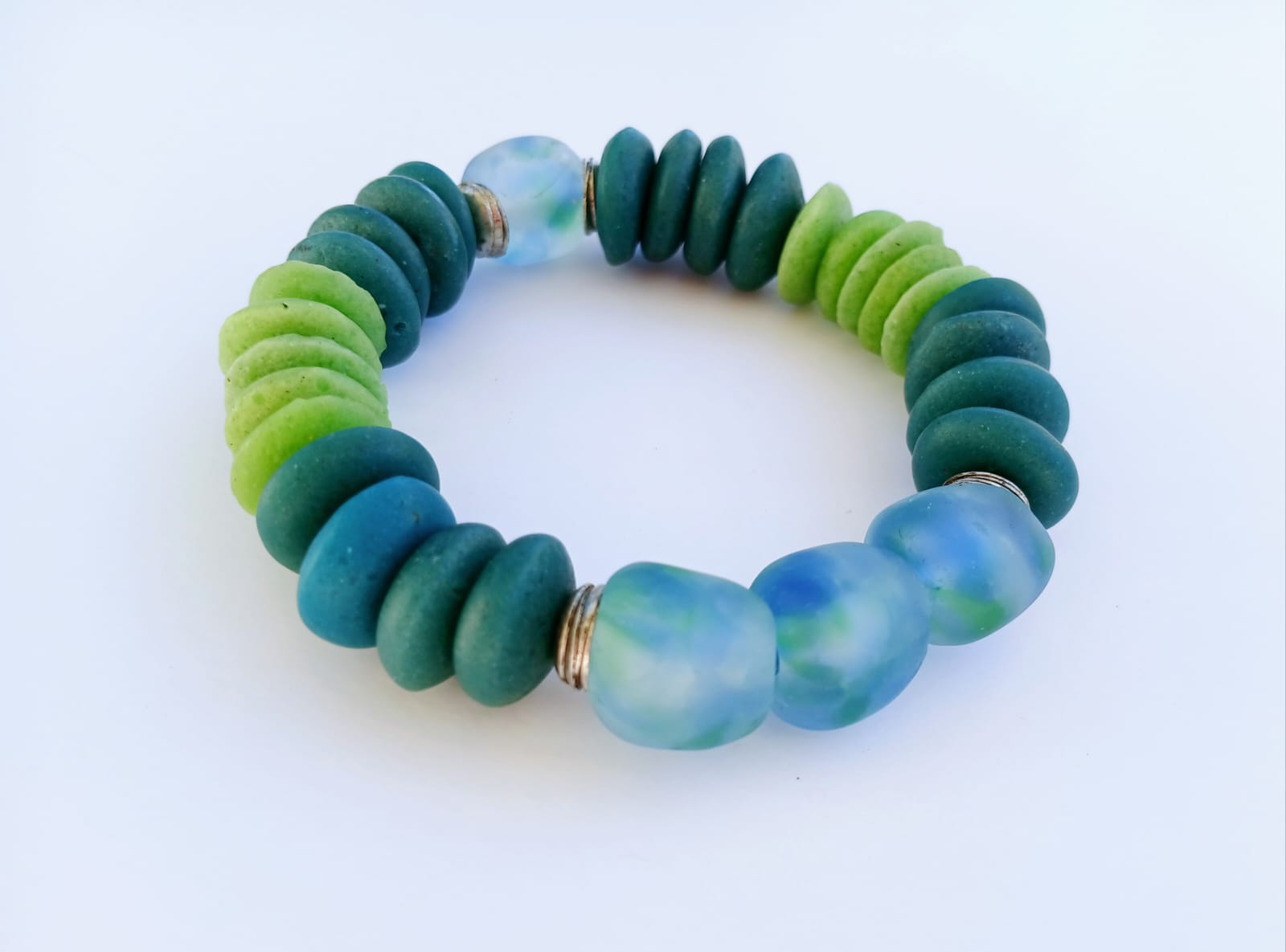 Multi Color Ashanti Blue Green Glass Beaded Bracelet featuring vibrant, handcrafted African trade beads in a bold, spiritual design. This colorful boho statement bracelet is inspired by traditional Ashanti craftsmanship, blending rich cultural heritage with modern style. Perfect handmade jewelry gift for women who love unique, meaningful accessories. Ideal for birthdays, holidays, or special occasions. A stunning piece full of color, energy, and artisan charm.