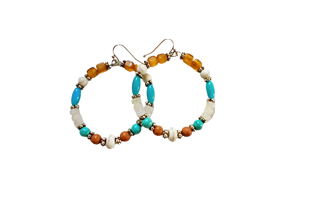 Multi-Color Hoop Earrings featuring vibrant handmade beads arranged in a boho style design, perfect for women who love colorful, trendy jewelry. These lightweight earrings are ideal for festivals, casual outings, or adding a playful touch to any outfit. Crafted with care, they offer comfortable wear and eye-catching appeal, making them a thoughtful gift for her. The bold mix of colors and intricate beadwork create a fun, artistic accessory that celebrates free-spirited, bohemian fashion.