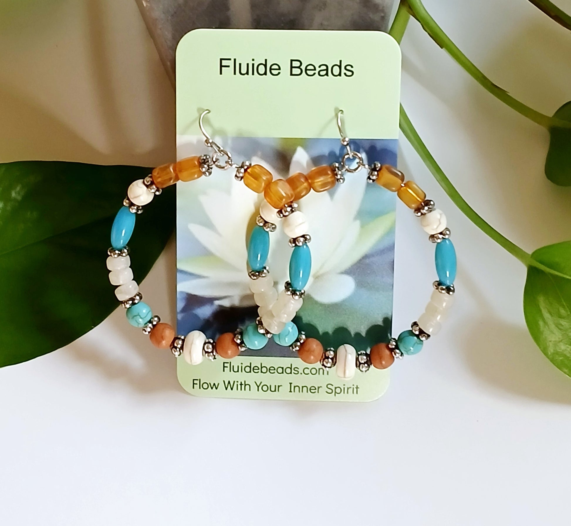 Multi-Color Hoop Earrings featuring vibrant handmade beads arranged in a boho style design, perfect for women who love colorful, trendy jewelry. These lightweight earrings are ideal for festivals, casual outings, or adding a playful touch to any outfit. Crafted with care, they offer comfortable wear and eye-catching appeal, making them a thoughtful gift for her. The bold mix of colors and intricate beadwork create a fun, artistic accessory that celebrates free-spirited, bohemian fashion.