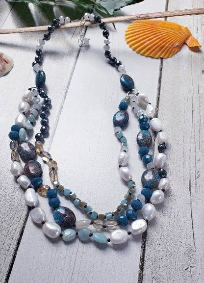 Hand-knotted multi-gemstone necklace for women featuring Jasper, Hematite, and freshwater Pearls in a stunning 3-strand beaded design. This handmade healing crystal jewelry combines earthy tones with elegant shimmer, promoting balance and strength. A thoughtful gift for her, perfect for birthdays, anniversaries, or any special occasion. Unique, artisanal, and full of natural beauty, this necklace adds charm to any outfit.