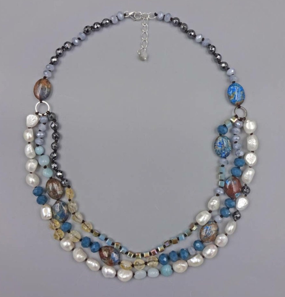 Hand-knotted multi-gemstone necklace for women featuring Jasper, Hematite, and freshwater Pearls in a stunning 3-strand beaded design. This handmade healing crystal jewelry combines earthy tones with elegant shimmer, promoting balance and strength. A thoughtful gift for her, perfect for birthdays, anniversaries, or any special occasion. Unique, artisanal, and full of natural beauty, this necklace adds charm to any outfit.