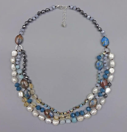 Hand-knotted multi-gemstone necklace for women featuring Jasper, Hematite, and freshwater Pearls in a stunning 3-strand beaded design. This handmade healing crystal jewelry combines earthy tones with elegant shimmer, promoting balance and strength. A thoughtful gift for her, perfect for birthdays, anniversaries, or any special occasion. Unique, artisanal, and full of natural beauty, this necklace adds charm to any outfit.