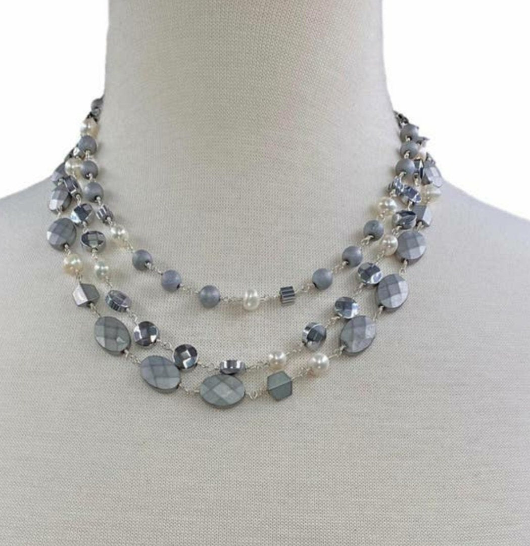 Natural Hematite and Pearl Beaded Necklace featuring a sparkly silver-tone design handcrafted for women who love elegant, unique jewelry. This eye-catching necklace combines the reflective shimmer of hematite with the soft luster of pearls, creating a sophisticated accessory perfect for both casual and formal wear. A thoughtful handmade gift for her, it blends natural beauty with artisanal style, making it a versatile statement piece for any jewelry collection.