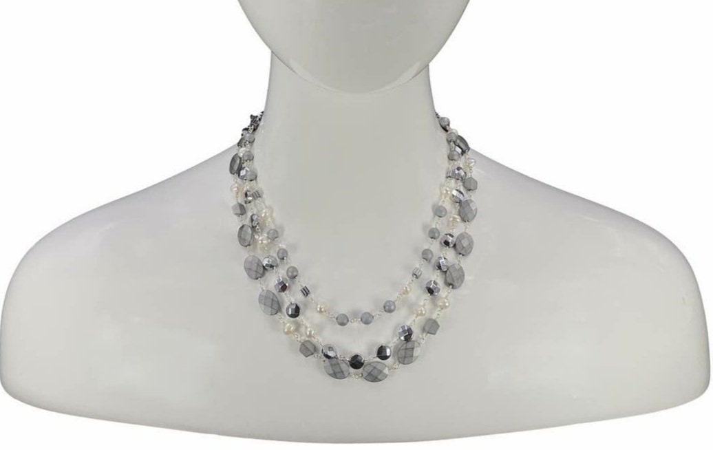 Natural Hematite and Pearl Beaded Necklace featuring a sparkly silver-tone design handcrafted for women who love elegant, unique jewelry. This eye-catching necklace combines the reflective shimmer of hematite with the soft luster of pearls, creating a sophisticated accessory perfect for both casual and formal wear. A thoughtful handmade gift for her, it blends natural beauty with artisanal style, making it a versatile statement piece for any jewelry collection.