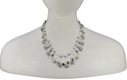 Natural Hematite and Pearl Beaded Necklace featuring a sparkly silver-tone design handcrafted for women who love elegant, unique jewelry. This eye-catching necklace combines the reflective shimmer of hematite with the soft luster of pearls, creating a sophisticated accessory perfect for both casual and formal wear. A thoughtful handmade gift for her, it blends natural beauty with artisanal style, making it a versatile statement piece for any jewelry collection.