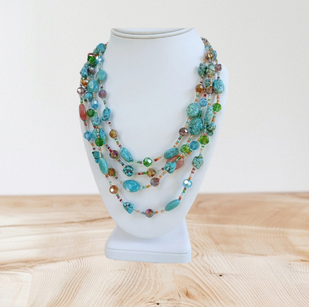 Turquoise, Magnesite, and Cherry Quartz Chunky Beaded Statement Necklace handcrafted for women who love bold, colorful jewelry. This handmade necklace features vibrant blue turquoise and magnesite beads combined with striking cherry quartz accents, creating a unique boho-style accessory. Perfect as a gift for her, it adds a pop of color and natural beauty to any outfit. Lightweight yet eye-catching, ideal for everyday wear or special occasions.