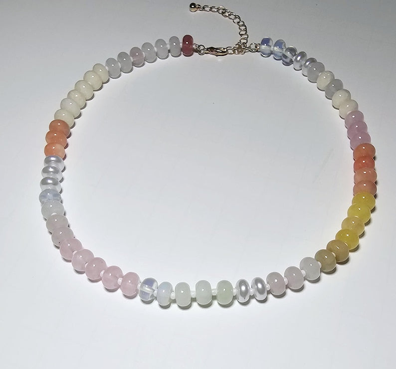 Multicolor Natural Agate and Glass Necklace featuring vibrant gemstone beads in a handcrafted design for women. This bold statement necklace blends colorful agate stones with shimmering glass elements, creating a unique and artistic accessory. Perfect as a thoughtful gift for her, it adds personality and energy to any outfit. Lightweight and stylish, this handmade beaded jewelry piece offers both natural beauty and boho-chic charm for everyday wear or special occasions.