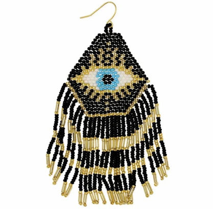 Mystical Eye Seed Bead Fringe Earrings featuring intricate handmade tribal designs with colorful seed bead fringes. These unique boho statement earrings offer bold dangles that capture attention with their vibrant colors and artistic craftsmanship. Perfect for women who love expressive, culturally inspired jewelry, they make an ideal gift for festivals, special occasions, or everyday wear. Lightweight and eye-catching, these earrings add a free-spirited, mystical touch to any outfit.