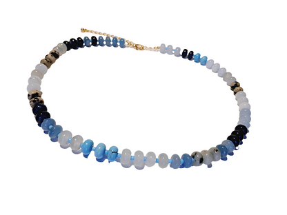 Natural Agate and Glass Beaded Necklace featuring a handcrafted design made with unique gemstone beads, perfect for women who love artistic and natural jewelry. This elegant agate necklace combines earthy tones and shimmering glass accents, creating a one-of-a-kind statement piece. Ideal as a thoughtful gift for her, it adds color and charm to any outfit. Lightweight and stylish, this handmade jewelry blends boho flair with the healing beauty of natural stones.