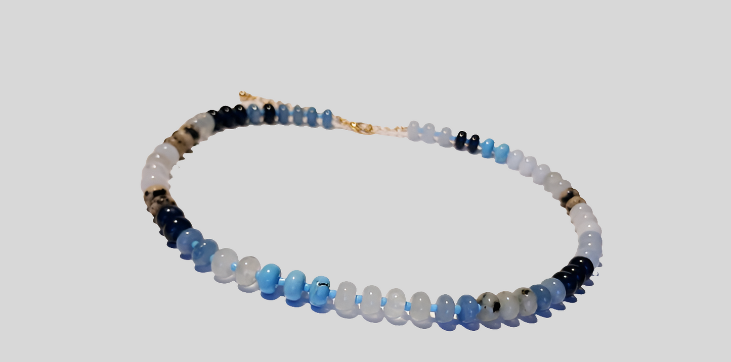 Natural Agate and Glass Beaded Necklace featuring a handcrafted design made with unique gemstone beads, perfect for women who love artistic and natural jewelry. This elegant agate necklace combines earthy tones and shimmering glass accents, creating a one-of-a-kind statement piece. Ideal as a thoughtful gift for her, it adds color and charm to any outfit. Lightweight and stylish, this handmade jewelry blends boho flair with the healing beauty of natural stones.