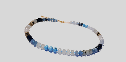 Natural Agate and Glass Beaded Necklace featuring a handcrafted design made with unique gemstone beads, perfect for women who love artistic and natural jewelry. This elegant agate necklace combines earthy tones and shimmering glass accents, creating a one-of-a-kind statement piece. Ideal as a thoughtful gift for her, it adds color and charm to any outfit. Lightweight and stylish, this handmade jewelry blends boho flair with the healing beauty of natural stones.