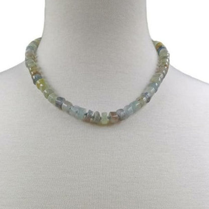 Natural Blue Kyanite Necklace for Women featuring polished button-shaped kyanite beads strung on a durable thread, finished with a sterling silver clasp for secure wear. This handmade gemstone necklace showcases the unique deep blue hues of kyanite, known for enhancing intuition and calmness. Perfect as a thoughtful gift for her, ideal for birthdays, anniversaries, or special occasions, combining elegance and spiritual energy.