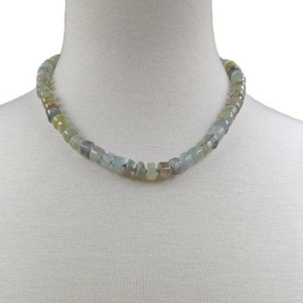 Natural Blue Kyanite Necklace for Women featuring polished button-shaped kyanite beads strung on a durable thread, finished with a sterling silver clasp for secure wear. This handmade gemstone necklace showcases the unique deep blue hues of kyanite, known for enhancing intuition and calmness. Perfect as a thoughtful gift for her, ideal for birthdays, anniversaries, or special occasions, combining elegance and spiritual energy.