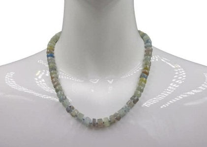 Natural Blue Kyanite Necklace for Women featuring polished button-shaped kyanite beads strung on a durable thread, finished with a sterling silver clasp for secure wear. This handmade gemstone necklace showcases the unique deep blue hues of kyanite, known for enhancing intuition and calmness. Perfect as a thoughtful gift for her, ideal for birthdays, anniversaries, or special occasions, combining elegance and spiritual energy.
