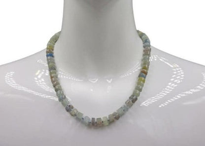 Natural Blue Kyanite Necklace for Women featuring polished button-shaped kyanite beads strung on a durable thread, finished with a sterling silver clasp for secure wear. This handmade gemstone necklace showcases the unique deep blue hues of kyanite, known for enhancing intuition and calmness. Perfect as a thoughtful gift for her, ideal for birthdays, anniversaries, or special occasions, combining elegance and spiritual energy.