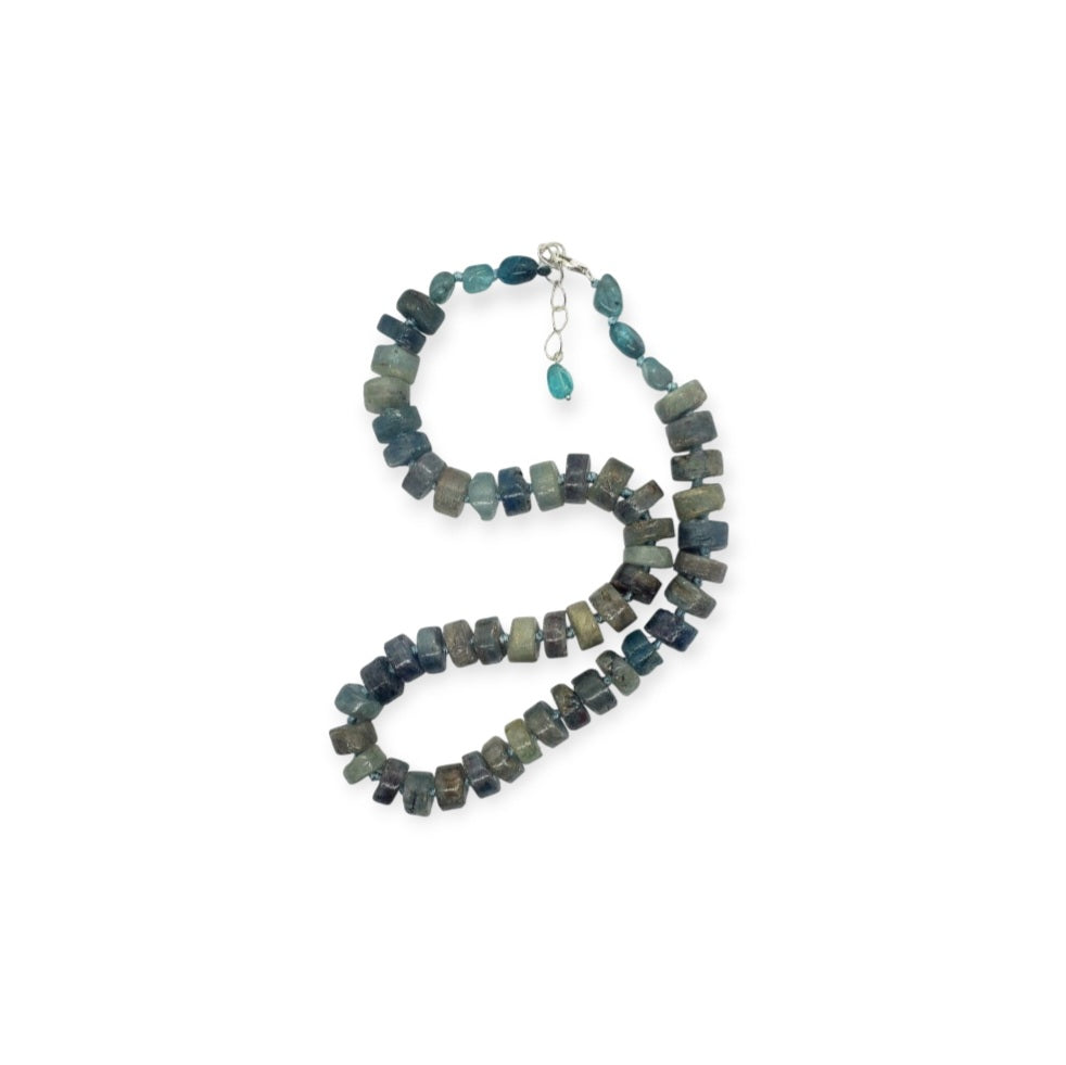 Natural Blue Kyanite Necklace for Women featuring polished button-shaped kyanite beads strung on a durable thread, finished with a sterling silver clasp for secure wear. This handmade gemstone necklace showcases the unique deep blue hues of kyanite, known for enhancing intuition and calmness. Perfect as a thoughtful gift for her, ideal for birthdays, anniversaries, or special occasions, combining elegance and spiritual energy.