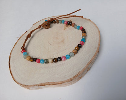 Natural stone and coconut shell beaded bracelet, handmade with eco-friendly materials, perfect for men and women who love earthy, boho style. This versatile bracelet features a unique blend of natural textures and colors, making it an ideal gift for her or him. Comfortable and durable, it adds a grounded, organic touch to any outfit. Perfect for casual wear, nature lovers, and those seeking sustainable, stylish jewelry with a meaningful vibe.