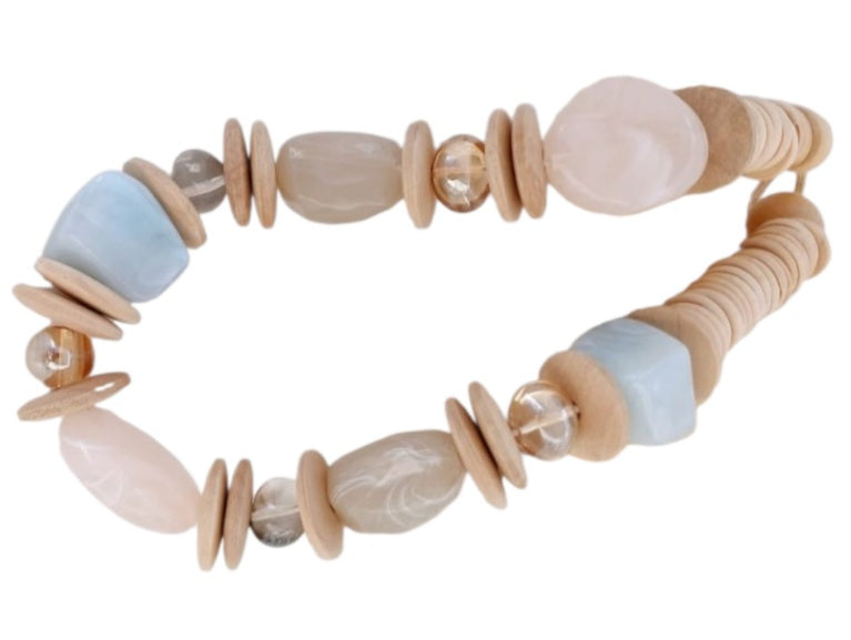 Handmade short necklace for women featuring natural stone and wood beads in a chunky, earthy design. This boho statement necklace blends organic textures and spiritual energy, making it a unique accessory for everyday wear or special occasions. Perfect as a thoughtful gift, the handcrafted piece highlights a harmonious mix of natural materials and bold style, ideal for those who appreciate artisanal and grounding jewelry.