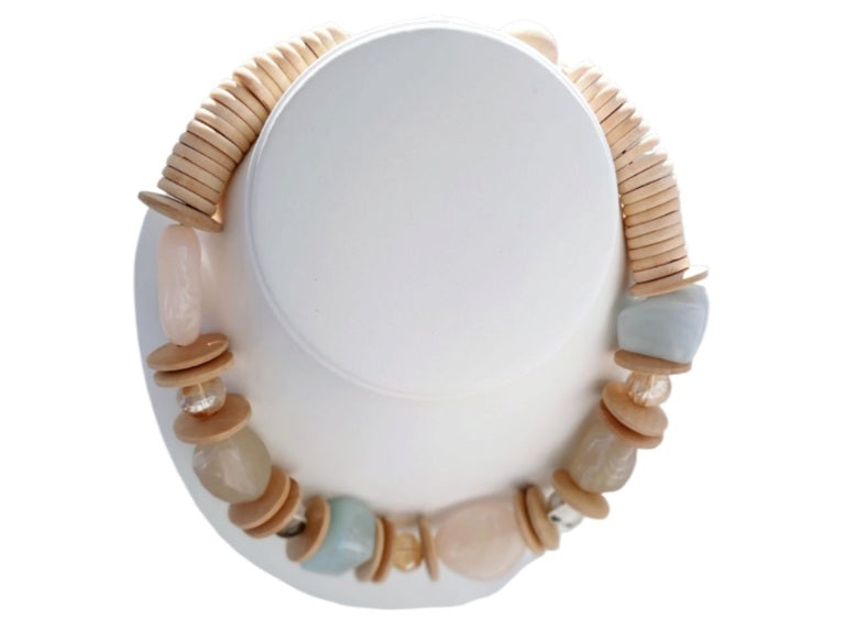 Handmade short necklace for women featuring natural stone and wood beads in a chunky, earthy design. This boho statement necklace blends organic textures and spiritual energy, making it a unique accessory for everyday wear or special occasions. Perfect as a thoughtful gift, the handcrafted piece highlights a harmonious mix of natural materials and bold style, ideal for those who appreciate artisanal and grounding jewelry.