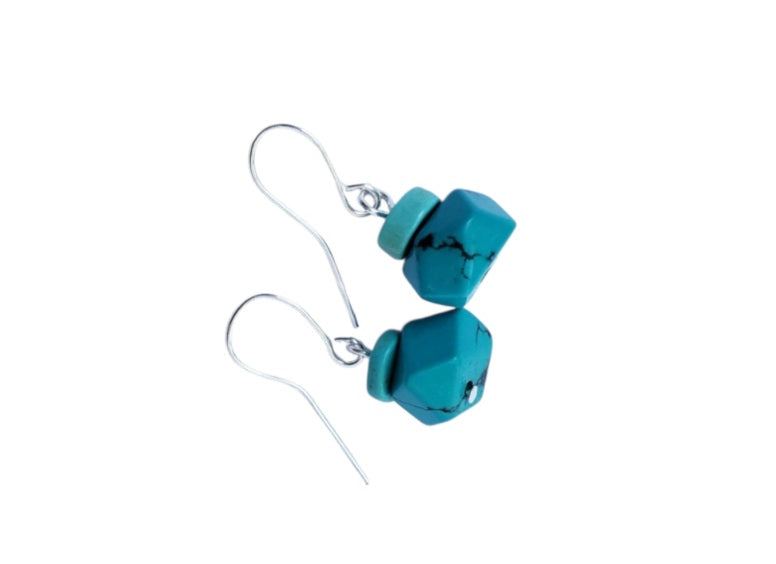 Natural Gemstone Turquoise Earrings crafted in vintage-inspired sterling silver, featuring handcrafted turquoise stones in a classic boho dangle design. Perfect for women who love earthy, artisan jewelry with timeless charm, these earrings add a pop of color and elegance to any look. Lightweight and eye-catching, they make a thoughtful handmade gift for birthdays, holidays, or special occasions. A stylish accessory blending natural beauty with vintage and bohemian flair.
