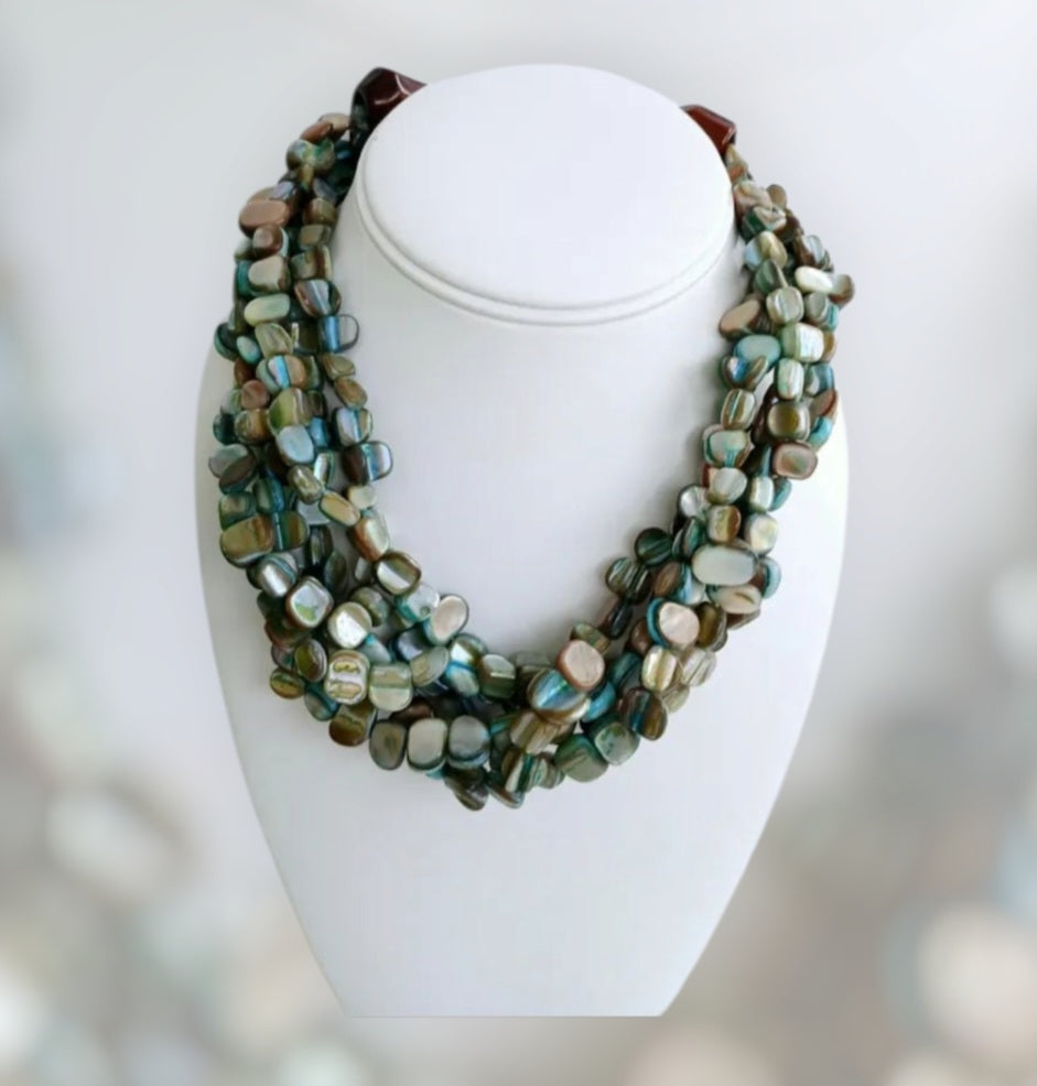 Neutral Chip Multi-Strand Abalone Shell and Pearl Necklace featuring chunky, bold beads handcrafted into a layered statement piece for women. This boho-style necklace combines the iridescent beauty of abalone shells with elegant pearls, creating a unique accessory perfect for adding natural charm and sophistication to any outfit. Lightweight and versatile, it makes a thoughtful handmade gift for her, ideal for everyday wear or special occasions with artisanal craftsmanship.