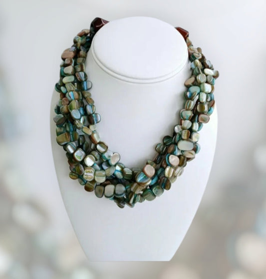 Neutral Chip Multi-Strand Abalone Shell and Pearl Necklace featuring chunky, bold beads handcrafted into a layered statement piece for women. This boho-style necklace combines the iridescent beauty of abalone shells with elegant pearls, creating a unique accessory perfect for adding natural charm and sophistication to any outfit. Lightweight and versatile, it makes a thoughtful handmade gift for her, ideal for everyday wear or special occasions with artisanal craftsmanship.