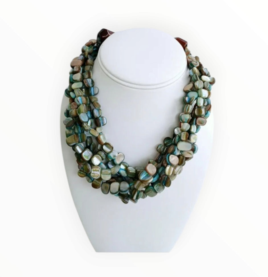 Neutral Chip Multi-Strand Abalone Shell and Pearl Necklace featuring chunky, bold beads handcrafted into a layered statement piece for women. This boho-style necklace combines the iridescent beauty of abalone shells with elegant pearls, creating a unique accessory perfect for adding natural charm and sophistication to any outfit. Lightweight and versatile, it makes a thoughtful handmade gift for her, ideal for everyday wear or special occasions with artisanal craftsmanship.