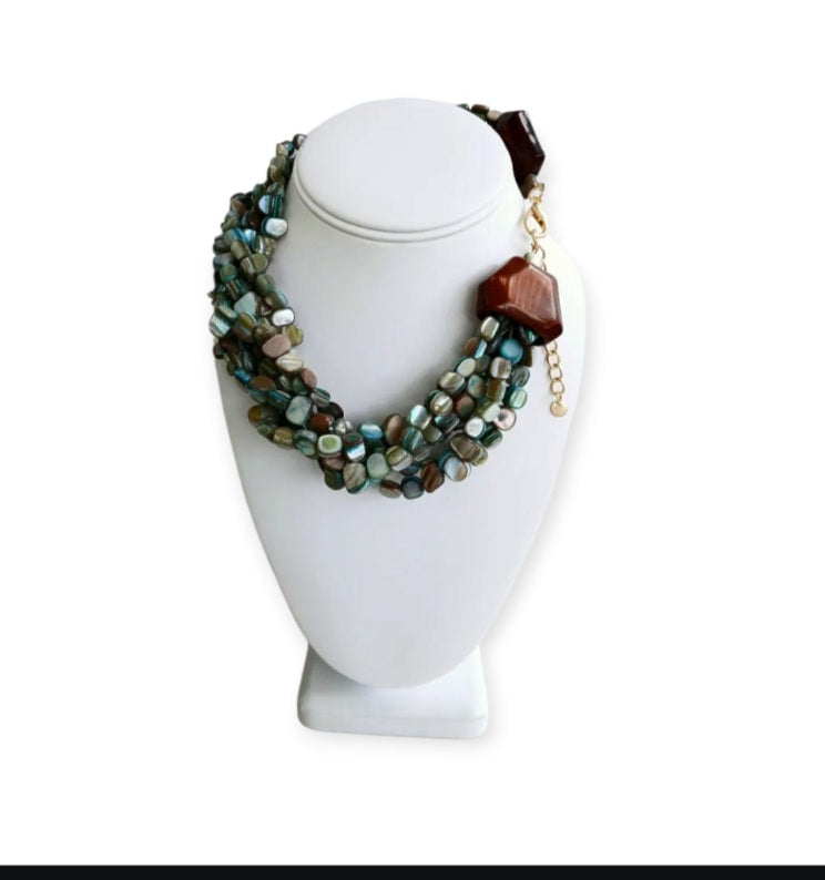 Neutral Chip Multi-Strand Abalone Shell and Pearl Necklace featuring chunky, bold beads handcrafted into a layered statement piece for women. This boho-style necklace combines the iridescent beauty of abalone shells with elegant pearls, creating a unique accessory perfect for adding natural charm and sophistication to any outfit. Lightweight and versatile, it makes a thoughtful handmade gift for her, ideal for everyday wear or special occasions with artisanal craftsmanship.