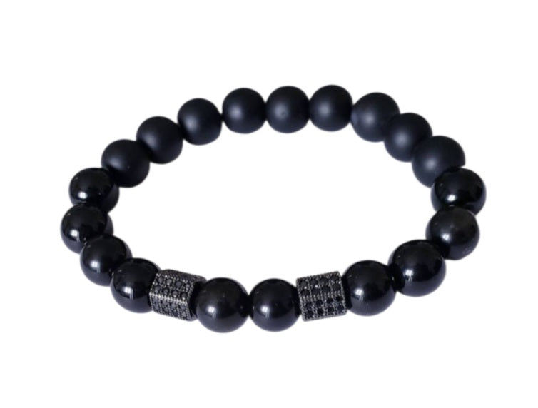 Black Obsidian Onyx Protection Bracelet handmade with natural crystal stones, including Hematite and Lava rock beads. This healing energy bracelet offers grounding and protective properties, perfect for men seeking balance, focus, and emotional strength. Ideal for yoga, meditation, or daily wear, the stylish charm design blends spiritual wellness with fashion. Unique crystal jewelry for men, handcrafted for holistic energy and intention.