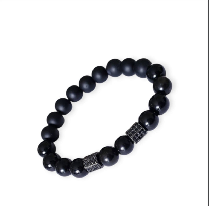 Black Obsidian Onyx Protection Bracelet handmade with natural crystal stones, including Hematite and Lava rock beads. This healing energy bracelet offers grounding and protective properties, perfect for men seeking balance, focus, and emotional strength. Ideal for yoga, meditation, or daily wear, the stylish charm design blends spiritual wellness with fashion. Unique crystal jewelry for men, handcrafted for holistic energy and intention.