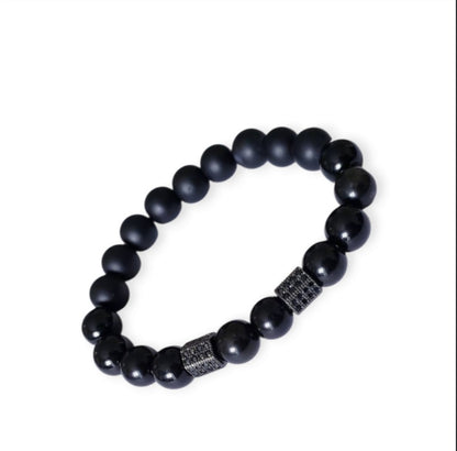 Black Obsidian Onyx Protection Bracelet handmade with natural crystal stones, including Hematite and Lava rock beads. This healing energy bracelet offers grounding and protective properties, perfect for men seeking balance, focus, and emotional strength. Ideal for yoga, meditation, or daily wear, the stylish charm design blends spiritual wellness with fashion. Unique crystal jewelry for men, handcrafted for holistic energy and intention.