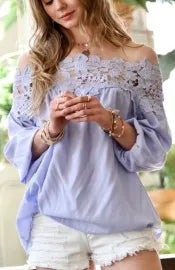 Off-shoulder ruffle sleeve top for women featuring delicate lace trim and puff sleeves for a feminine, boho-inspired look. This loose fit blouse offers a relaxed yet stylish silhouette, perfect for summer wear and casual chic outfits. Lightweight and breathable, it pairs effortlessly with jeans, skirts, or shorts for an easygoing yet polished vibe. Ideal for warm-weather days, festivals, or everyday bohemian style.

