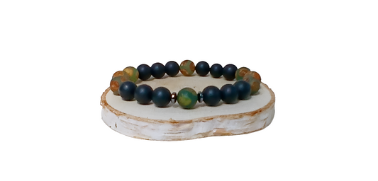 Handmade Tibetan-style black onyx and agate bracelet featuring healing gemstones known for their protective and grounding properties. This men’s lucky charm jewelry piece blends traditional craftsmanship with modern style, making it an ideal gift for him. Perfect for everyday wear or special occasions, the bracelet offers both spiritual benefits and a bold, masculine accessory that complements any outfit with its sleek black design.