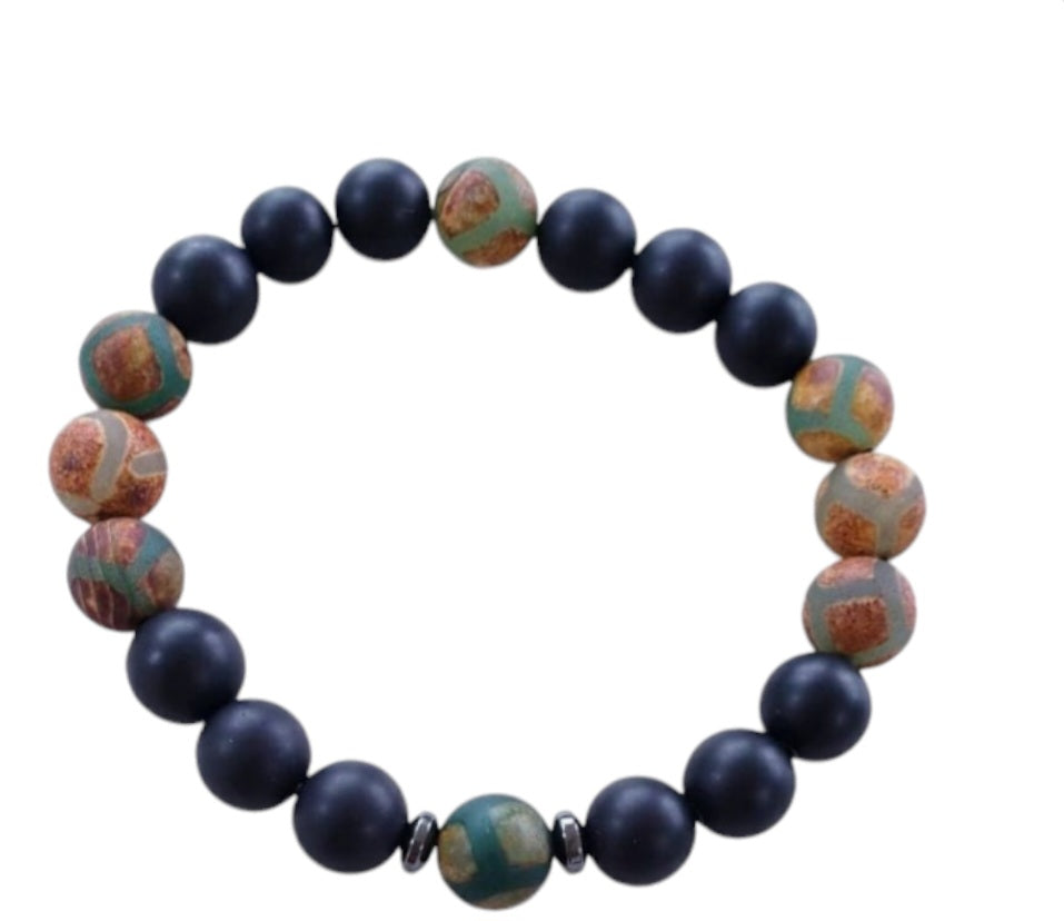 Handmade Tibetan-style black onyx and agate bracelet featuring healing gemstones known for their protective and grounding properties. This men’s lucky charm jewelry piece blends traditional craftsmanship with modern style, making it an ideal gift for him. Perfect for everyday wear or special occasions, the bracelet offers both spiritual benefits and a bold, masculine accessory that complements any outfit with its sleek black design.