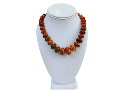Handmade chunky agate necklace for women featuring vibrant carnelian, amber, and vintage-style lucite beads in bold orange tones. This unique statement necklace blends natural gemstones with retro-inspired design, creating a one-of-a-kind accessory perfect for those who love standout jewelry. Ideal as a gift for her, it adds a warm, artistic touch to any outfit and showcases a mix of earthy elegance and vintage charm.