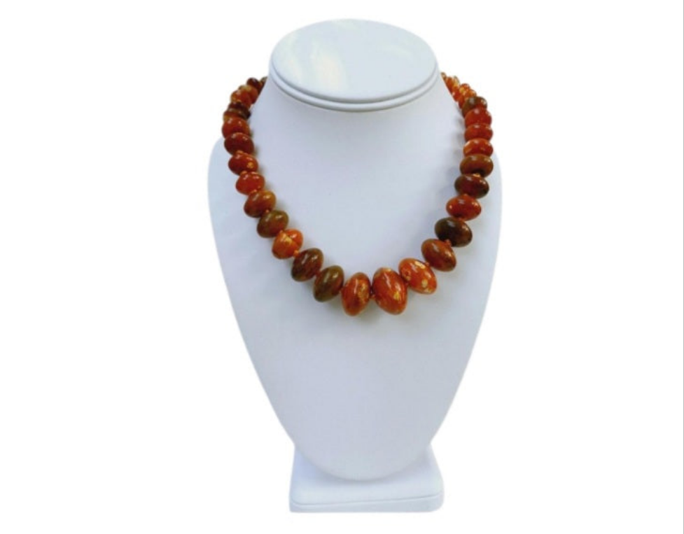 Handmade chunky agate necklace for women featuring vibrant carnelian, amber, and vintage-style lucite beads in bold orange tones. This unique statement necklace blends natural gemstones with retro-inspired design, creating a one-of-a-kind accessory perfect for those who love standout jewelry. Ideal as a gift for her, it adds a warm, artistic touch to any outfit and showcases a mix of earthy elegance and vintage charm.