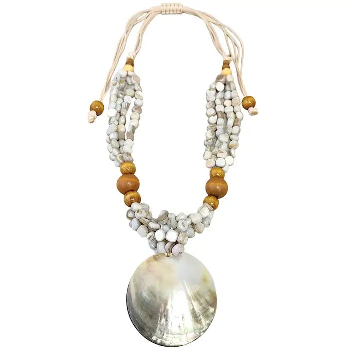 Pastel blue seashell necklace featuring an abalone pendant with natural wood beads, perfect for coastal boho beach style. Inspired by the ocean and mermaid aesthetics, this unique handmade jewelry piece makes a thoughtful gift for sea lovers. Lightweight and easy to wear, it adds a touch of seaside charm to any summer outfit. Ideal for beach vacations, festivals, or casual everyday wear with a nautical, nature-inspired vibe.