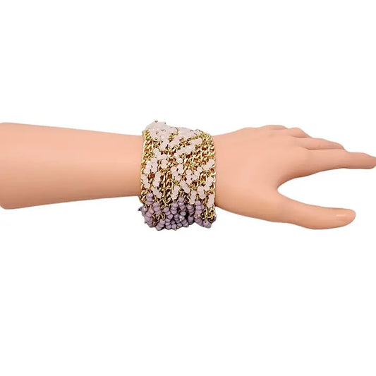 Handmade chunky statement bracelet featuring pastel crystal fringe accents on a bold gold link chain, designed for women who love vibrant and artistic fashion accessories. This eye-catching bracelet blends soft colors with a glamorous edge, making it a perfect gift for birthdays, holidays, or special occasions. Crafted with care, it adds a playful yet elegant touch to any outfit, ideal for dressing up casual looks or completing evening wear.