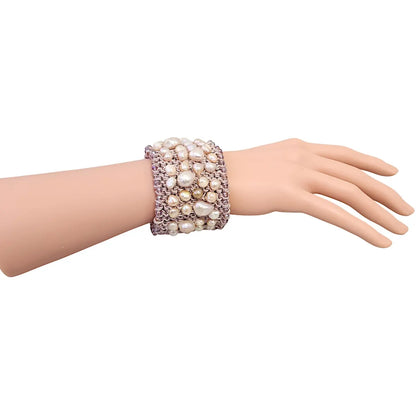 Pastel Pink Pearl Crochet Cuff Bracelet handmade with chunky freshwater pearls and shimmering thread in a soft boho style. This statement gemstone bracelet features a wide, textured design perfect for layering or wearing alone. Ideal gift for women who love unique, artisanal jewelry. Elegant yet casual, this pastel pink cuff adds a romantic, feminine touch to any outfit. Perfect for birthdays, anniversaries, or bridal accessories.