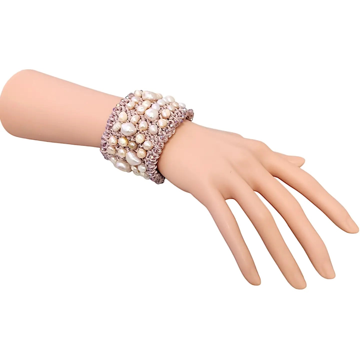 Pastel Pink Pearl Crochet Cuff Bracelet handmade with chunky freshwater pearls and shimmering thread in a soft boho style. This statement gemstone bracelet features a wide, textured design perfect for layering or wearing alone. Ideal gift for women who love unique, artisanal jewelry. Elegant yet casual, this pastel pink cuff adds a romantic, feminine touch to any outfit. Perfect for birthdays, anniversaries, or bridal accessories.