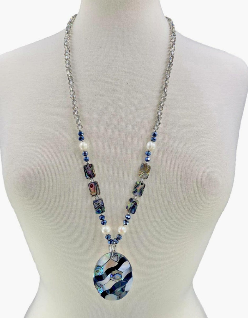 Pearl Abalone Mosaic Pendant Necklace featuring a long, chunky handmade design with shimmering mother of pearl and abalone gemstone inlays. This bold statement jewelry piece showcases natural iridescence and intricate craftsmanship, perfect for women who love unique, ocean-inspired accessories. Ideal as a birthday gift or special occasion present, it blends elegance and earthy beauty, making it a standout addition to any jewelry collection with artistic, coastal charm.