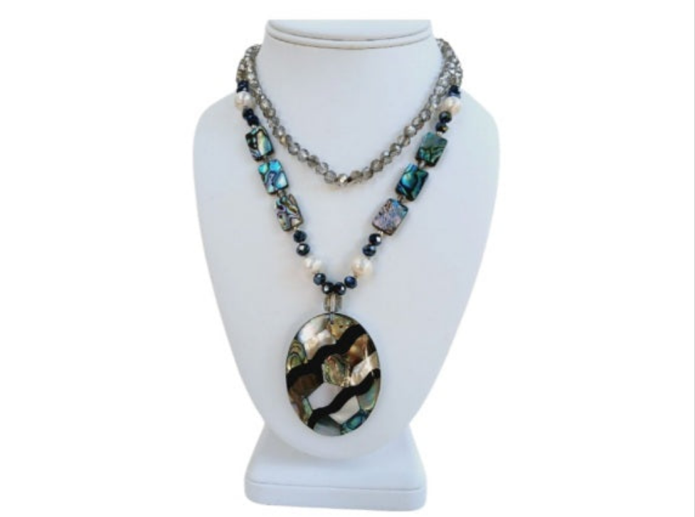 Pearl Abalone Mosaic Pendant Necklace featuring a long, chunky handmade design with shimmering mother of pearl and abalone gemstone inlays. This bold statement jewelry piece showcases natural iridescence and intricate craftsmanship, perfect for women who love unique, ocean-inspired accessories. Ideal as a birthday gift or special occasion present, it blends elegance and earthy beauty, making it a standout addition to any jewelry collection with artistic, coastal charm.