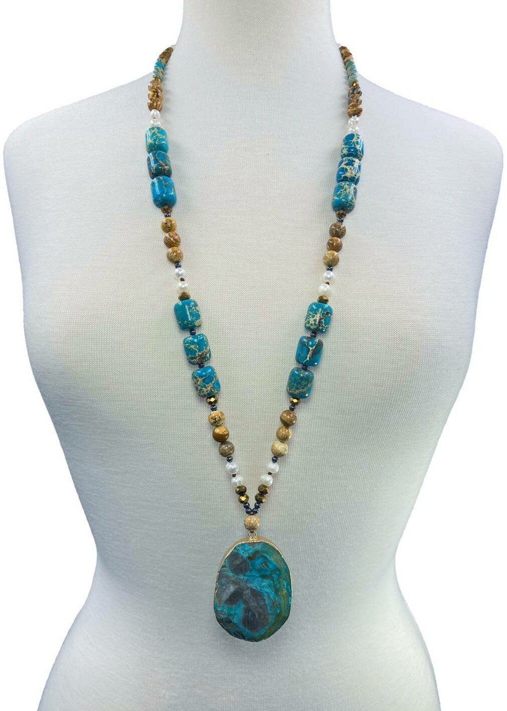 Statement Pearl Jasper Hematite Beaded Necklace featuring bold, stylish beads and a unique pendant design. This handmade jewelry piece blends lustrous pearls, earthy jasper, and sleek hematite for a striking, fashionable look. Perfect gift for women who appreciate artisanal craftsmanship and statement accessories. Ideal for adding an elegant yet edgy touch to both casual and formal outfits. Unique fashion jewelry crafted with care and style.