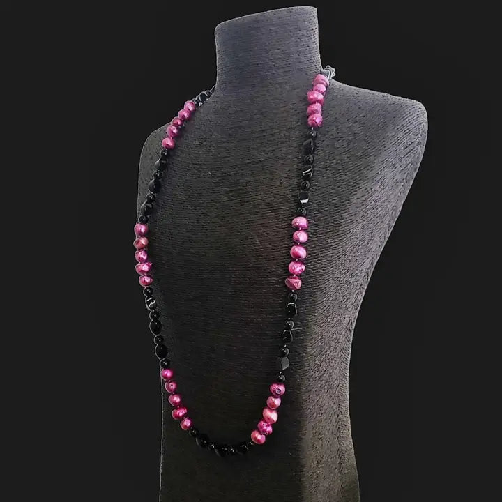 Pink and black freshwater pearl necklace featuring a crystal cluster pendant on a 36-inch chain, creating an elegant statement piece. This handmade jewelry combines natural pearls and sparkling crystals, perfect for formal occasions or special events. A sophisticated gift for her, blending classic beauty with modern design. Ideal for weddings, parties, or upscale gatherings, adding a touch of refined charm to any outfit.
