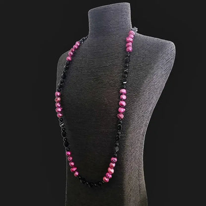 Pink and black freshwater pearl necklace featuring a crystal cluster pendant on a 36-inch chain, creating an elegant statement piece. This handmade jewelry combines natural pearls and sparkling crystals, perfect for formal occasions or special events. A sophisticated gift for her, blending classic beauty with modern design. Ideal for weddings, parties, or upscale gatherings, adding a touch of refined charm to any outfit.