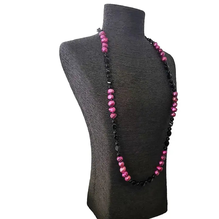 Pink and black freshwater pearl necklace featuring a crystal cluster pendant on a 36-inch chain, creating an elegant statement piece. This handmade jewelry combines natural pearls and sparkling crystals, perfect for formal occasions or special events. A sophisticated gift for her, blending classic beauty with modern design. Ideal for weddings, parties, or upscale gatherings, adding a touch of refined charm to any outfit.