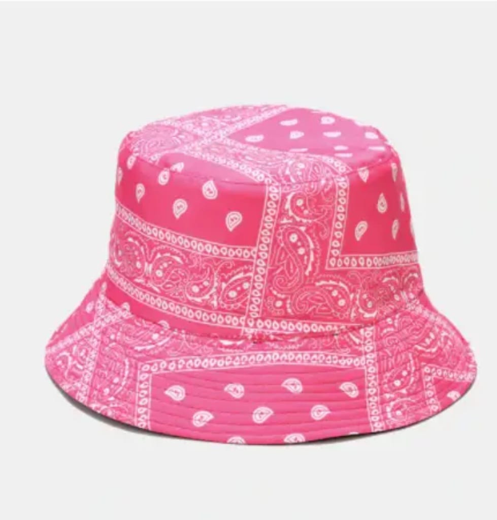 Pink paisley print bandana bucket hat designed for lightweight comfort and sun protection. This trendy unisex hat is perfect for spring and summer wear, offering a stylish look for beach days, travel, festivals, or casual outings. With its eye-catching paisley design and breathable fabric, this bucket hat combines fashion and function. Stay cool, shaded, and on-trend with this versatile warm-weather accessory.