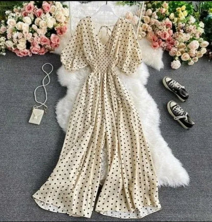 Brown, red, and white polka dot jumpsuit for women featuring a sexy V-neck, puff short sleeves, and a loose, wide-leg design for comfortable wear. This high-waisted one-piece outfit is made in the USA and combines playful patterns with a flattering silhouette. Ideal for casual outings, parties, or summer events, the breathable fabric and stylish cut make it a versatile and chic wardrobe addition.